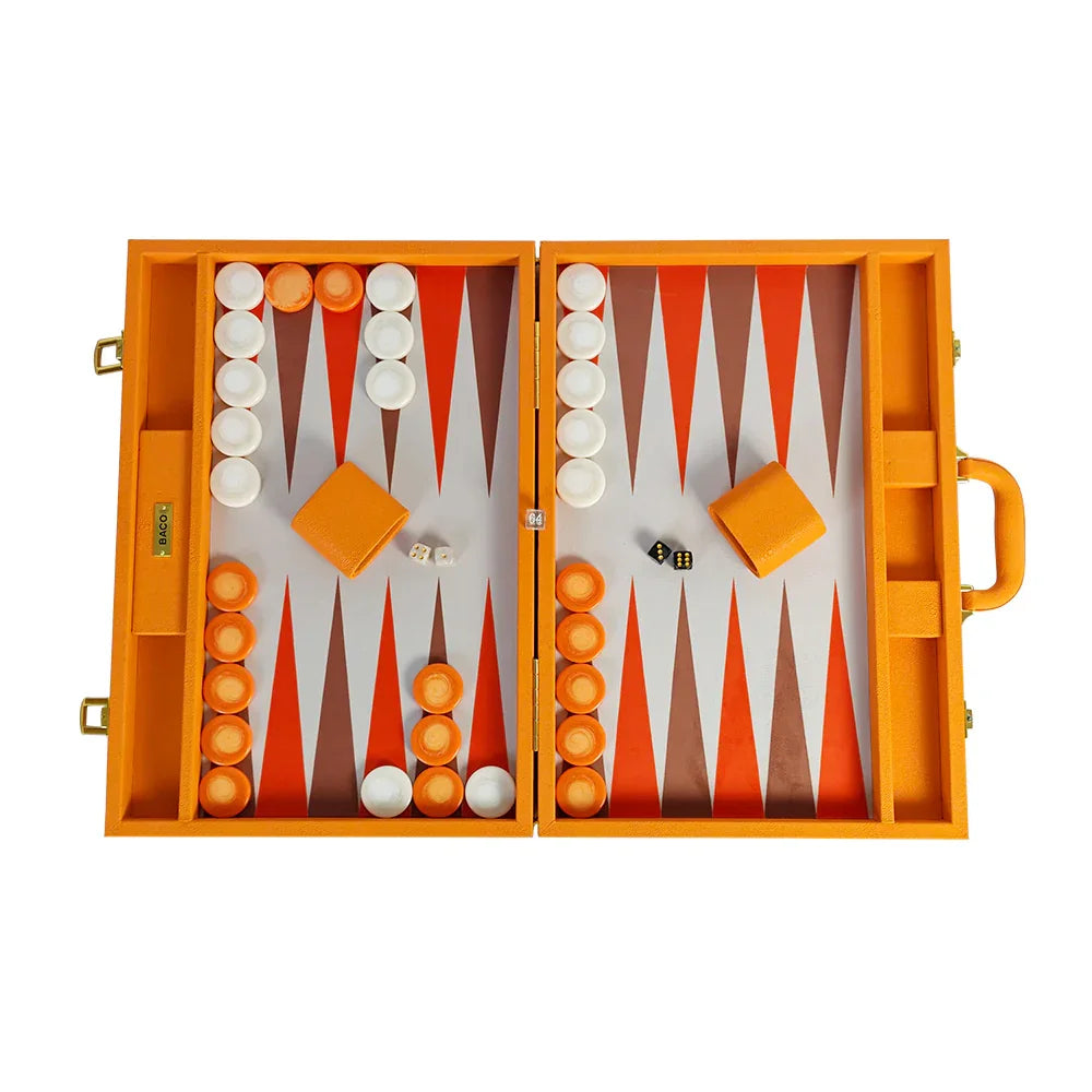 Luxury orange vegan leather backgammon set with white and orange checkers, two dice and two leather dice cups