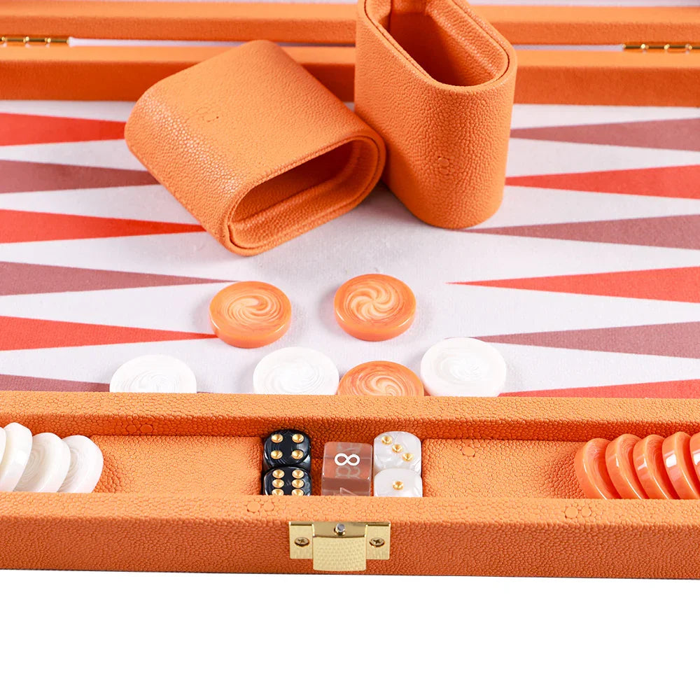 Luxury vegan leather backgammon set in vibrant orange with matching dice cups and game pieces